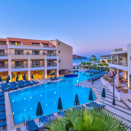 Porto Platanias Beach Resort & Spa Exterior photo The resort at night