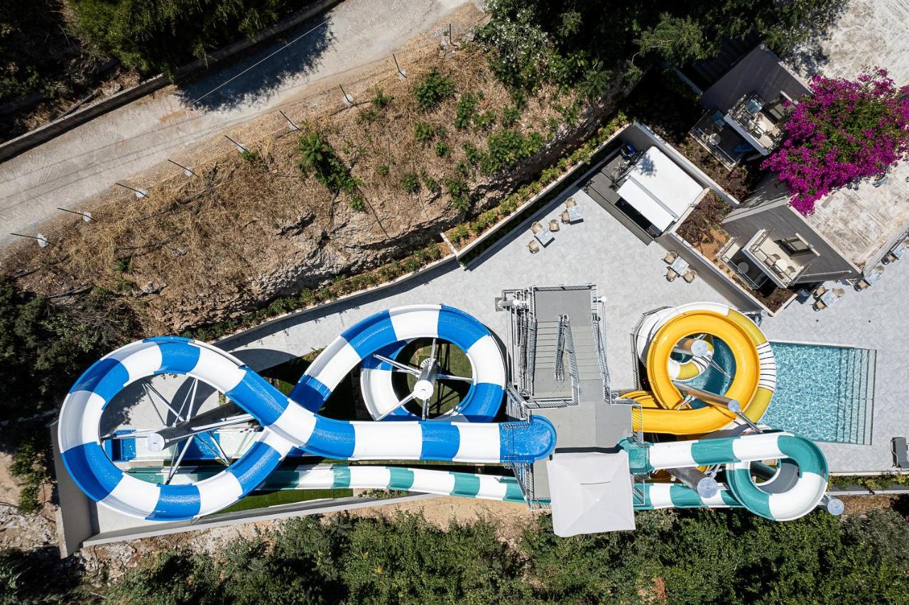 Porto Platanias Beach Resort & Spa Exterior photo Aerial view of the water park