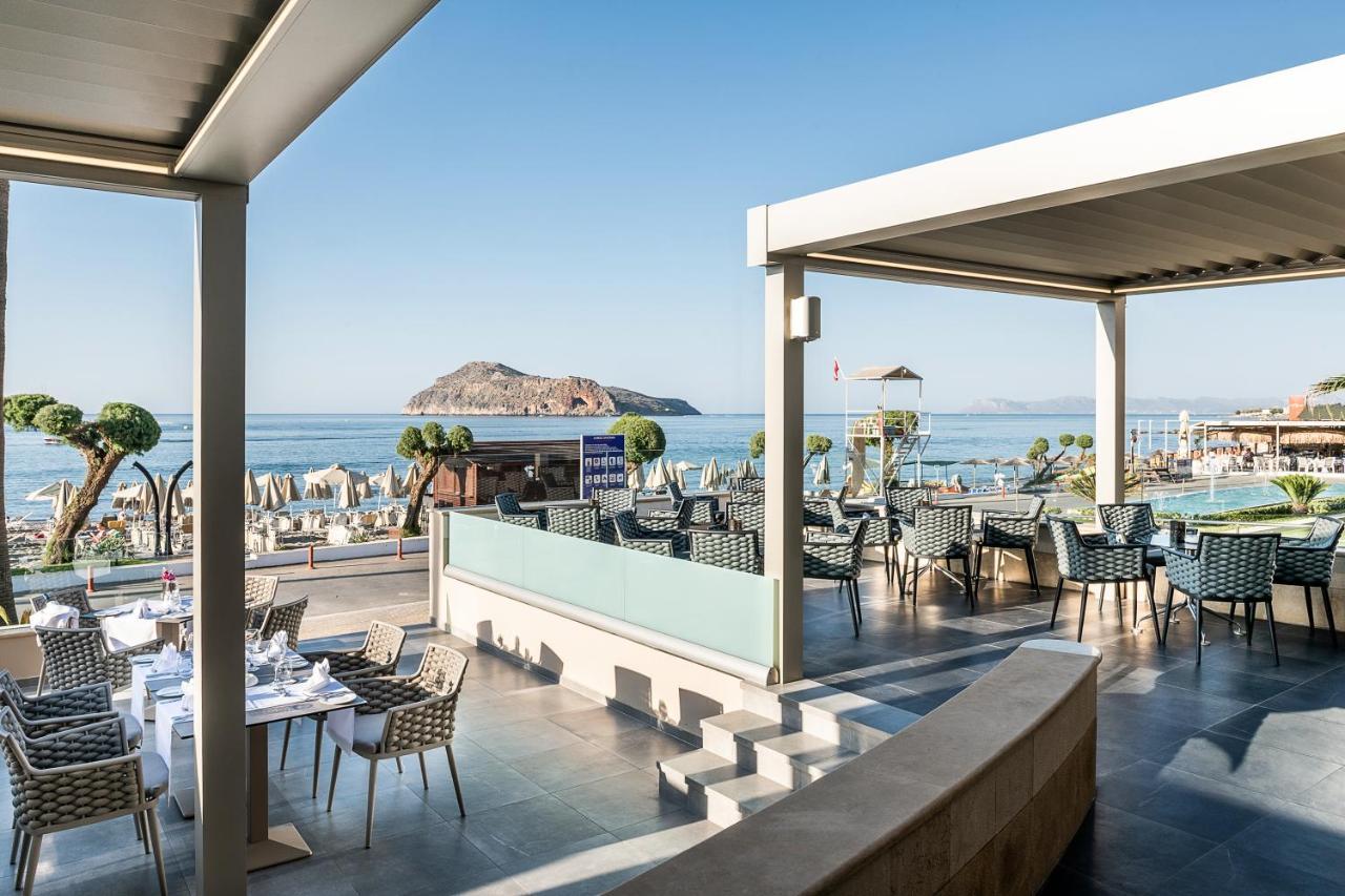 Porto Platanias Beach Resort & Spa Exterior photo The resort's main restaurant