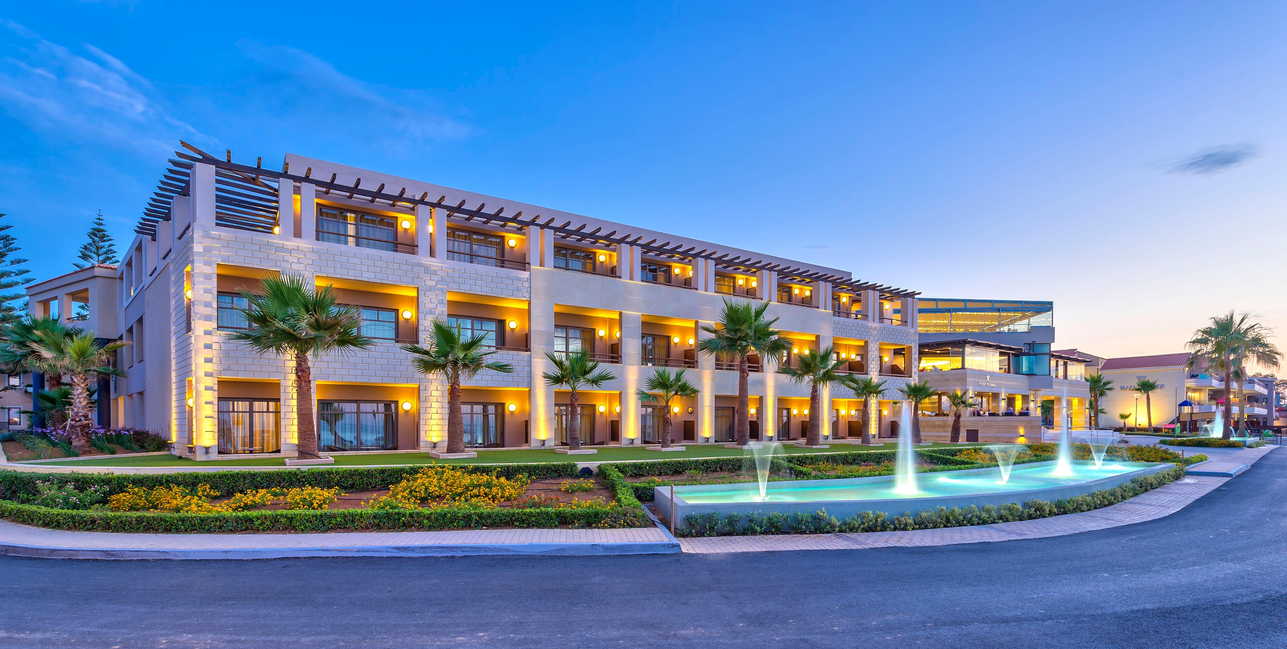 Porto Platanias Beach Resort & Spa Exterior photo The resort at night